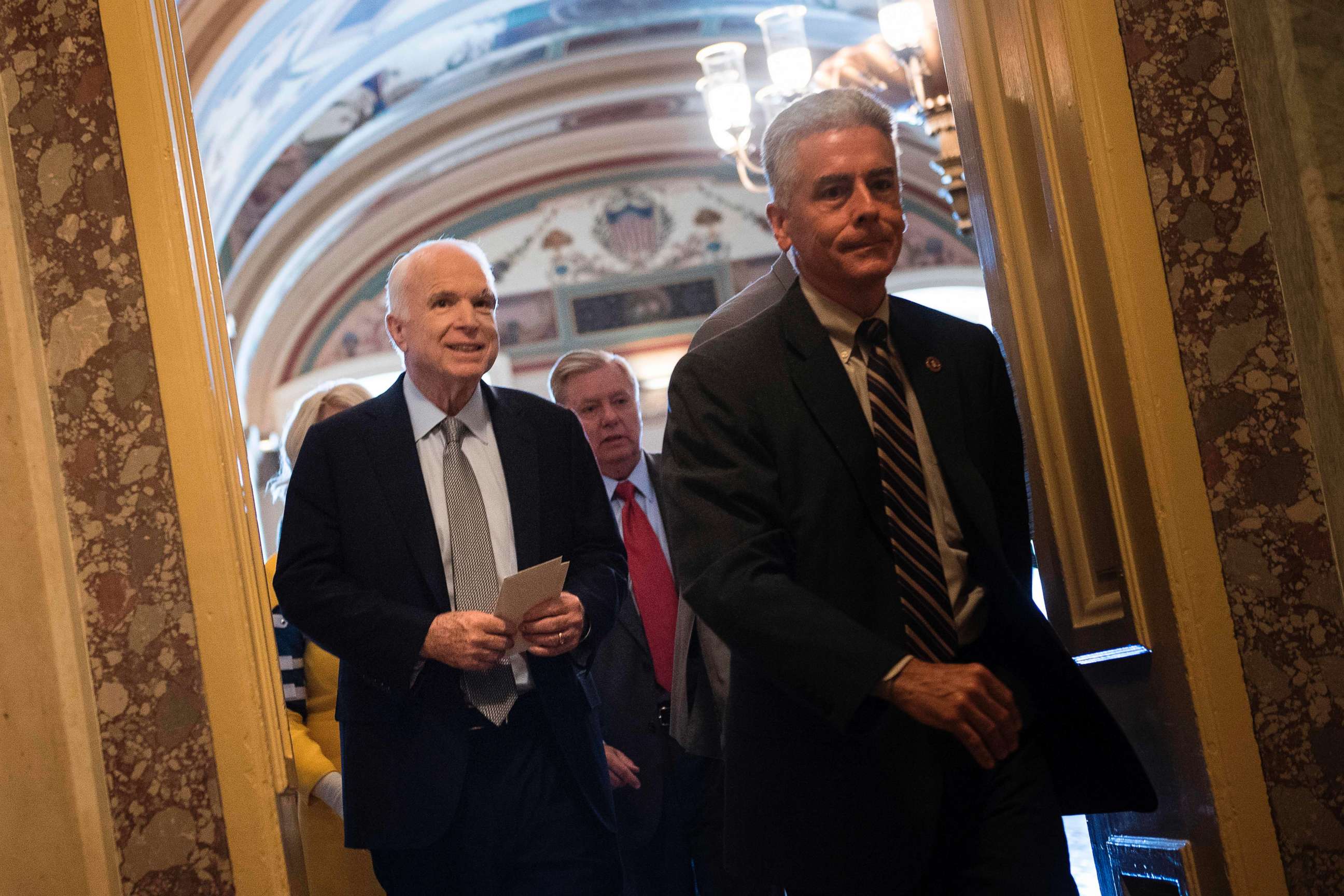 PHOTO: Senator John McCain (R-AZ) after a procedural vote on healthcare on Capitol Hill July 25, 2017 in Washington, D.C. McCain, who is suffering from cancer, received a standing ovation from his colleagues as he entered the chamber.