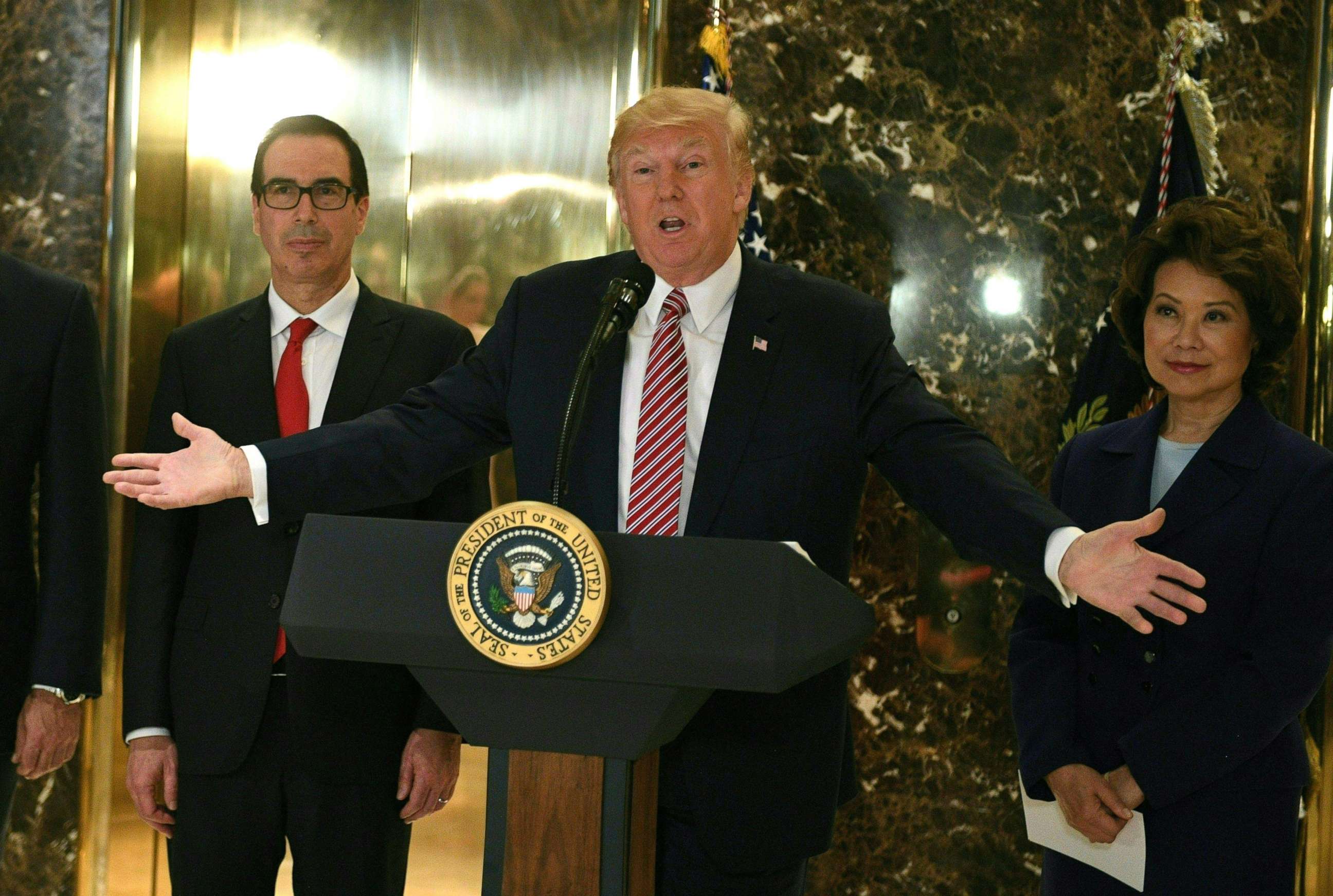 PHOTO: President Donald Trump speaks to the press about protests in Charlottesville, V.A., in the lobby at Trump Tower in New York on August 15, 2017.