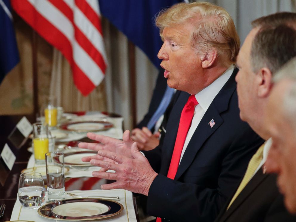 U.S. President Donald Trump gestures while speaking to NATO Secretary General Jens Stoltenberg during their bilateral breakfast, Wednesday, July 11, 2018 in Brussels, Belgium.