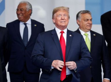 PHOTO: President Donald Trump reacts as he poses for a family photo at the start of the NATO summit in Brussels, July 11, 2018.