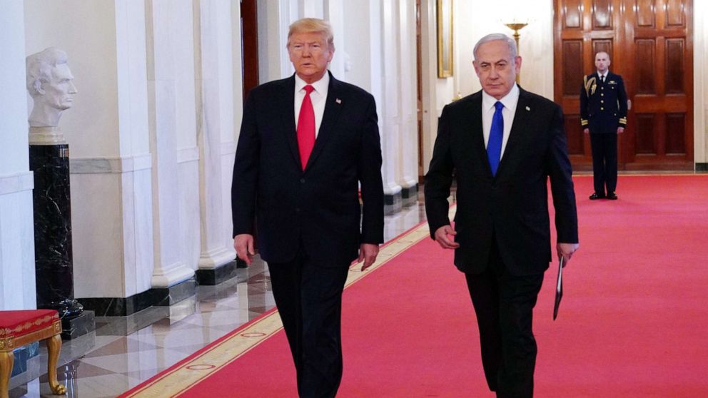 PHOTO: President Donald Trump and Israeli Prime Minister Benjamin Netanyahu arrive for an announcement of Trump's Middle East peace plan in the East Room of the White House in Washington, D.C on Jan. 28, 2020.
