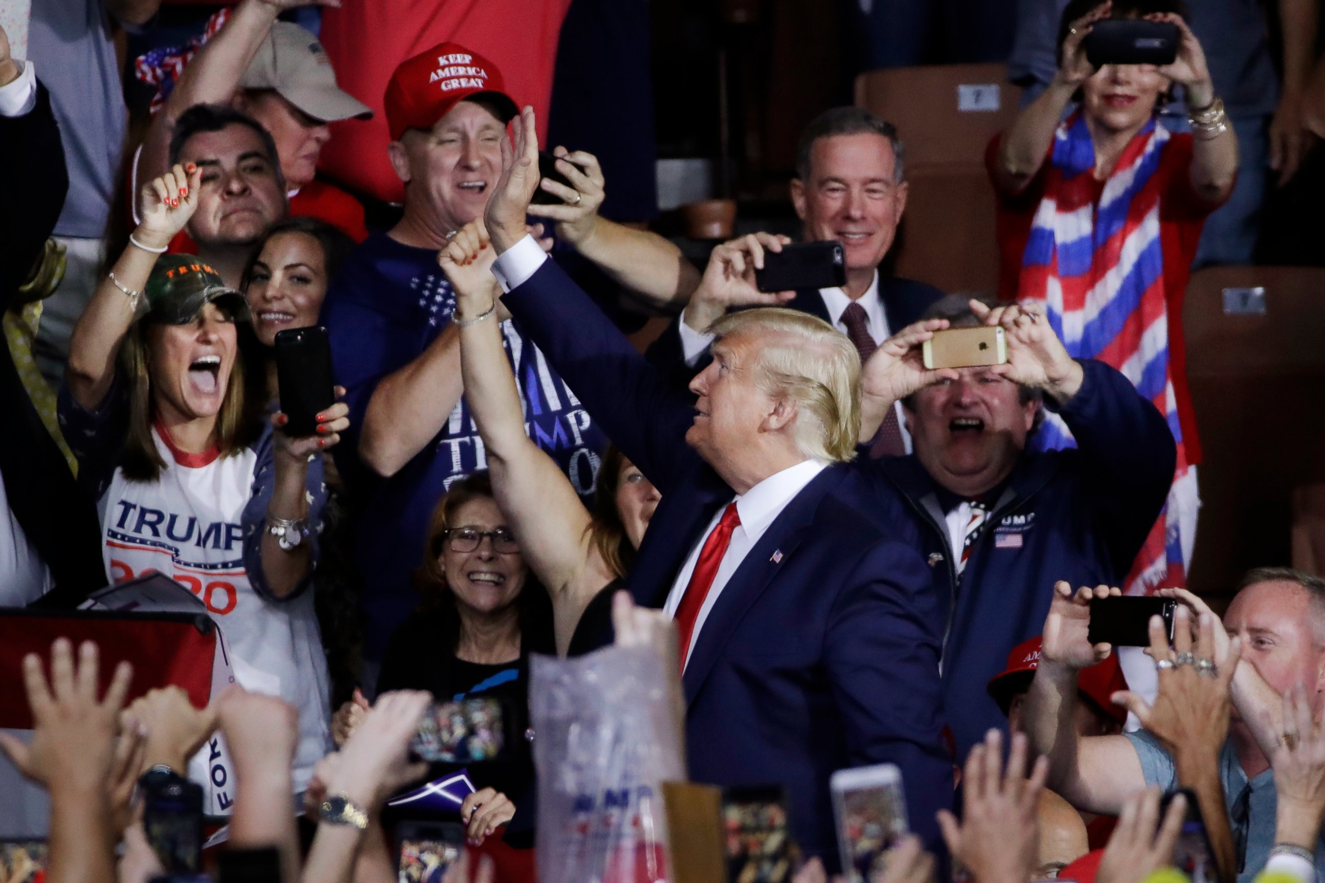 PHOTO: Supporters cheer as President Donald Trump arrives to a campaign rally, Thursday, Aug. 15, 2019, in Manchester, N.H.