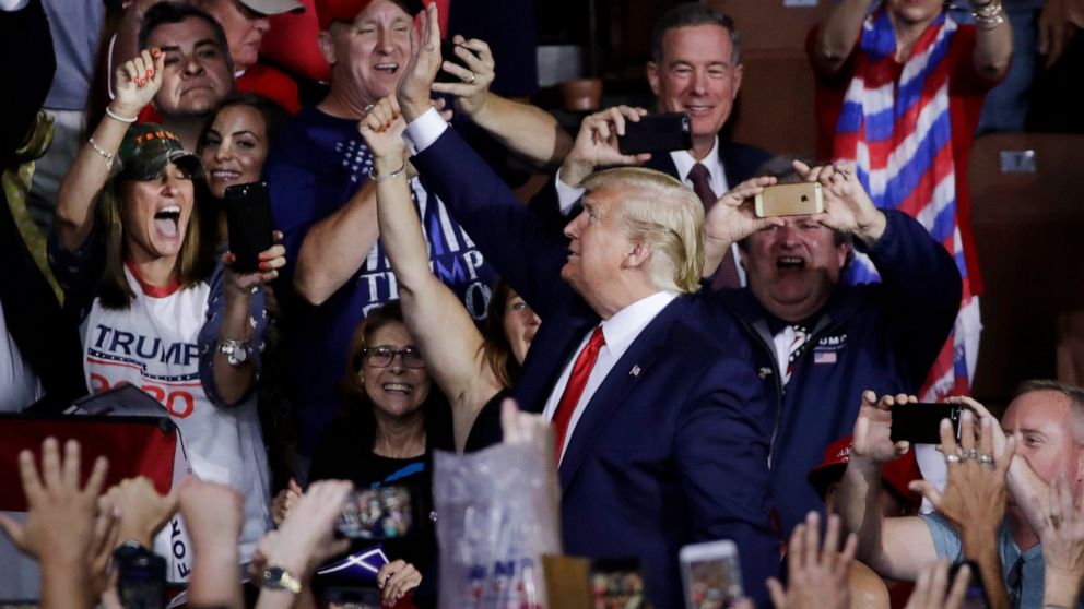 PHOTO: Supporters cheer as President Donald Trump arrives to a campaign rally, Thursday, Aug. 15, 2019, in Manchester, N.H.