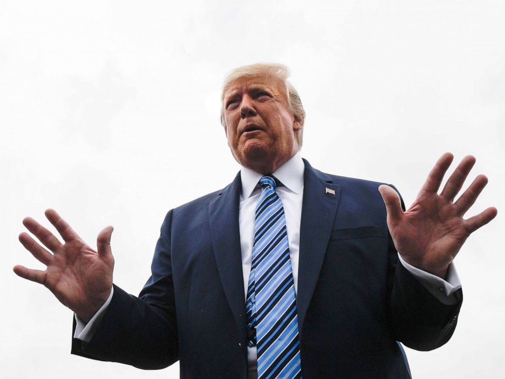 PHOTO: President Donald Trump talks to reporters at Morristown Municipal Airport in Morristown, N.J., Aug. 13, 2019.