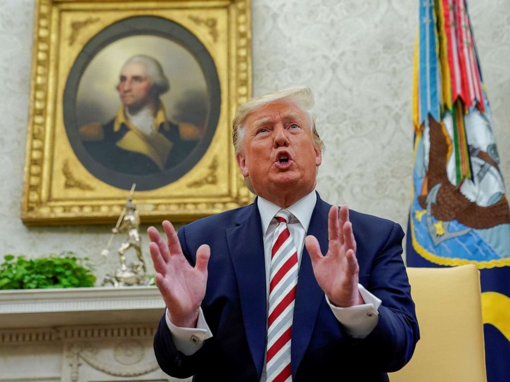PHOTO: U.S. President Donald Trump answers questions from reporters as he meets with Romanias President Klaus Iohannis in the Oval Office of the White House in Washington, U.S. August 20, 2019.
