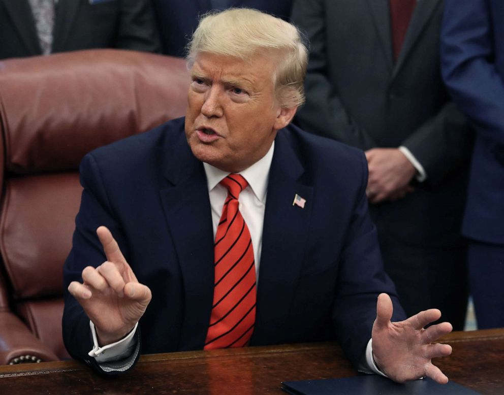 PHOTO: President Donald Trump President Trump speaks to reporters about Roger Stone after signing the Supporting Veterans in STEM Careers Act the Oval office at the White House on Feb. 11, 2020, in Washington.