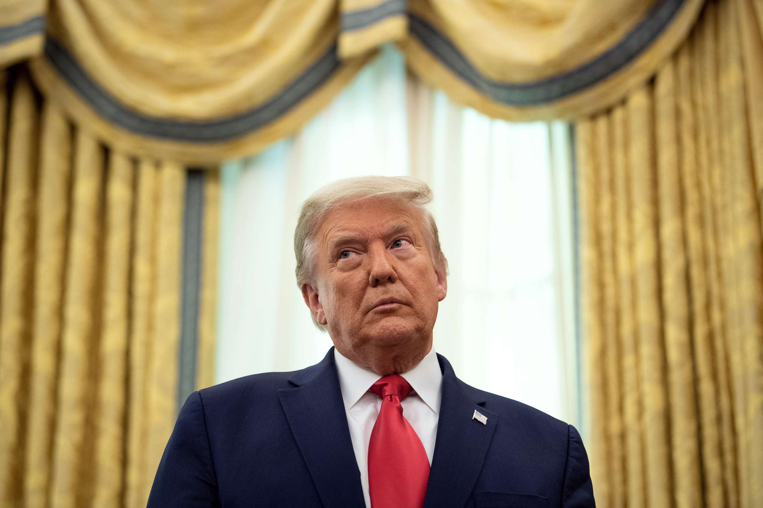 PHOTO: President Donald Trump listens during a ceremony in the Oval Office of the White House, Dec. 3, 2020, in Washington, DC.