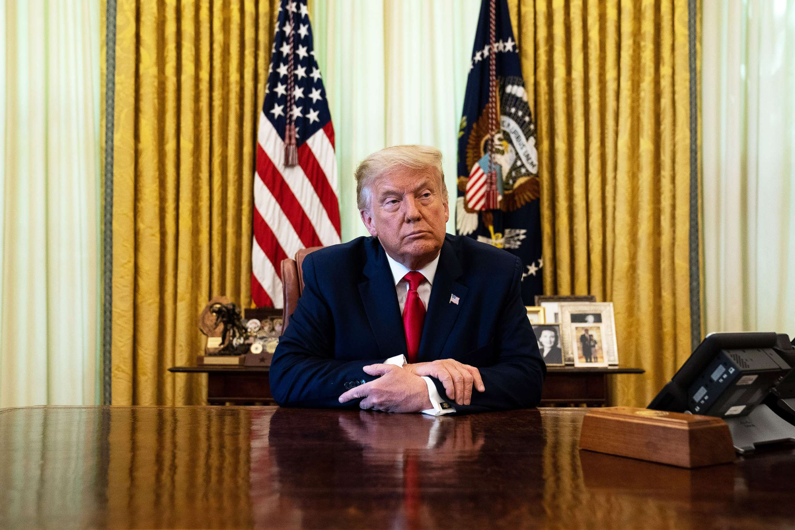 PHOTO: President Donald Trump listens during an event in the Oval Office of the White House, Aug. 28, 2020 in Washington, DC.