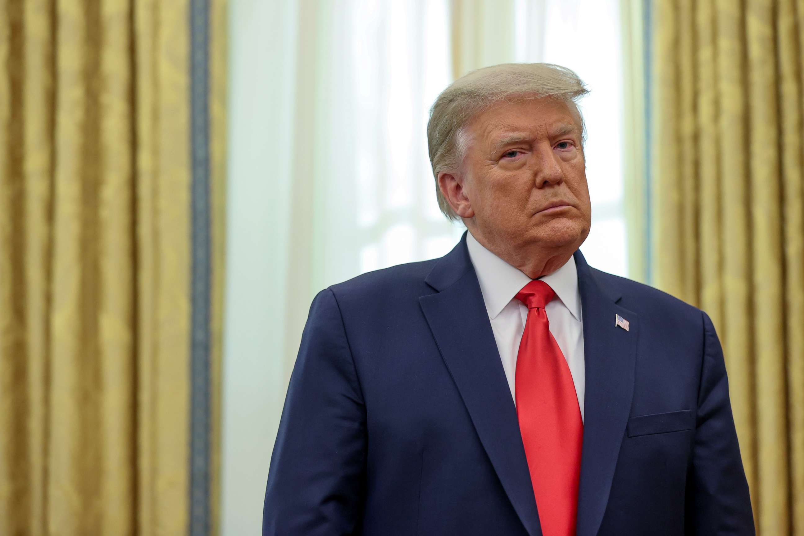 PHOTO: President Donald Trump participates in a medal ceremony in the Oval Office at the White House in Washington, DC., Dec. 3, 2020.