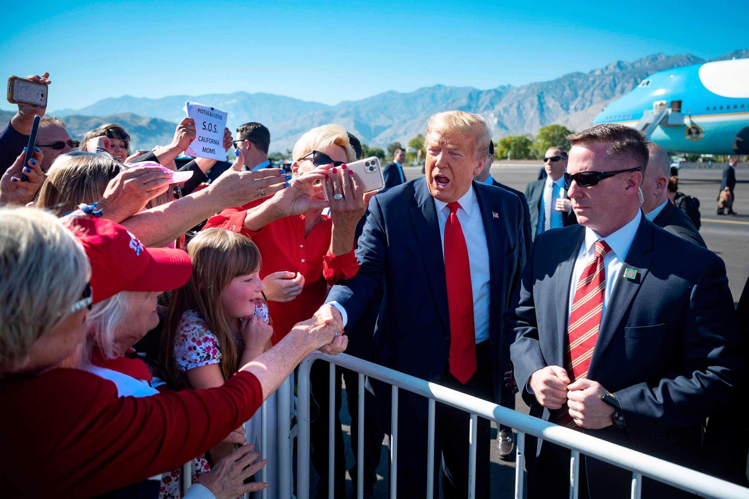 PHOTO: President Donald Trump shakes hands with supporters as he arrives in Palm Springs, Calif., Feb. 19, 2020.