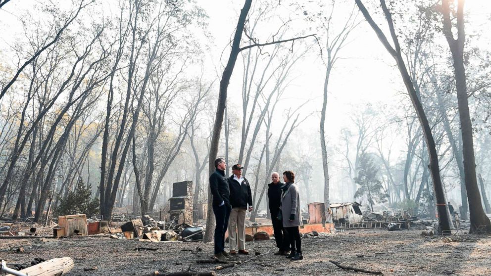 PHOTO: President Donald Trump looks on with Paradise Mayor Jody Jones, Governor of California Jerry Brown, and Lieutenant Governor of California, Gavin Newsom, as they view damage from wildfires in Paradise, Calif., Nov. 17, 2018.