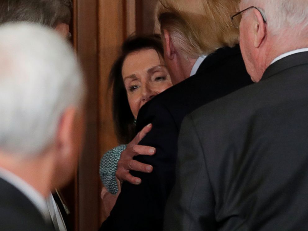 PHOTO: House Speaker Nancy Pelosi is embraced and embraced by President Donald Trump at the 37th Annual Friends of Ireland Luncheon at the US Capitol Building in Washington, DC, on March 14, 2019.