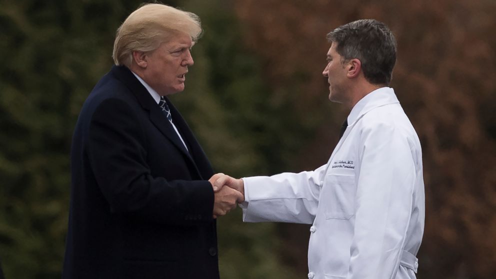 President Donald Trump shakes hands with White House Physician Rear Admiral Dr. Ronny Jackson, following his annual physical at Walter Reed National Military Medical Center in Bethesda, Maryland, Jan. 12, 2018.