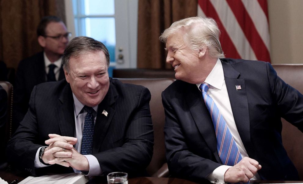 PHOTO: Secretary of State Mike Pompeo and President Trump share a laugh during a cabinet meeting at the White House, July 18, 2018, in Washington, D.C.