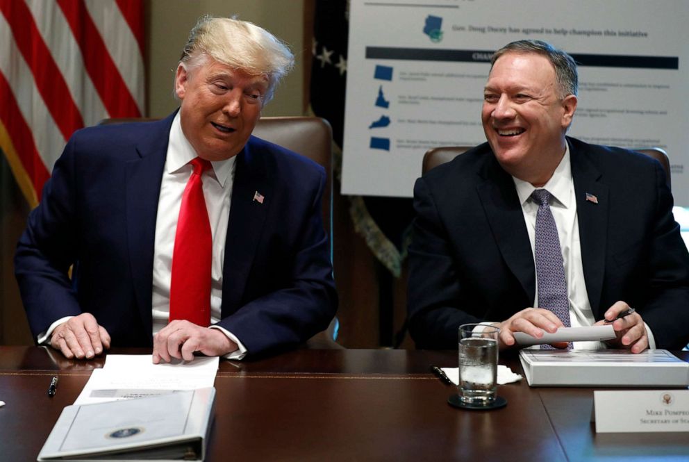 PHOTO: In this Oct. 21, 2019, file photo, President Donald Trump and Secretary of State Mike Pompeo laugh during a Cabinet Meeting at the White House in Washington, DC.