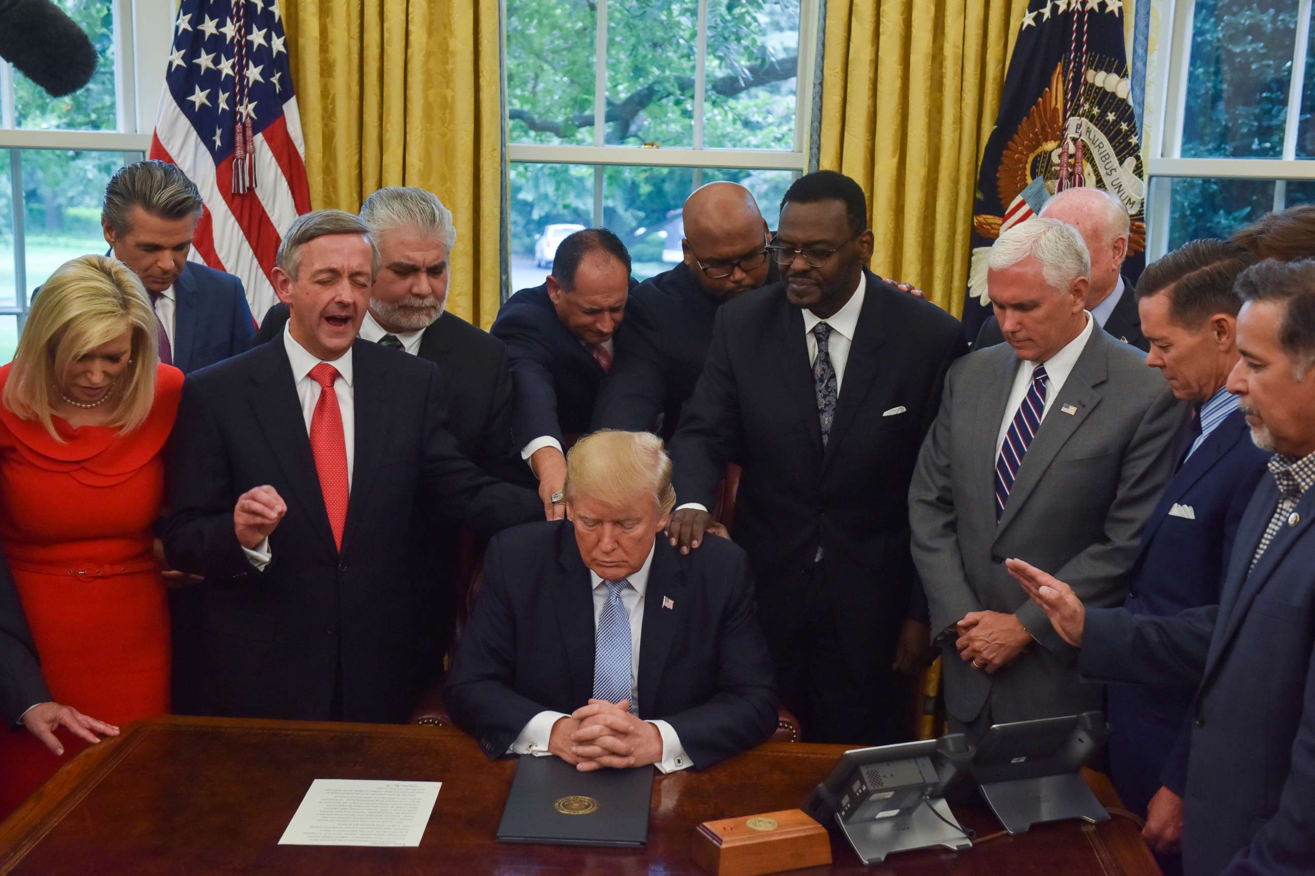 PHOTO: Donald J. Trump, backed by faith leaders, declared a National Day of Prayer for victims of Hurrican Harvey in the Oval Office of the White House on Sept. 1, 2017, in Washington, DC. 