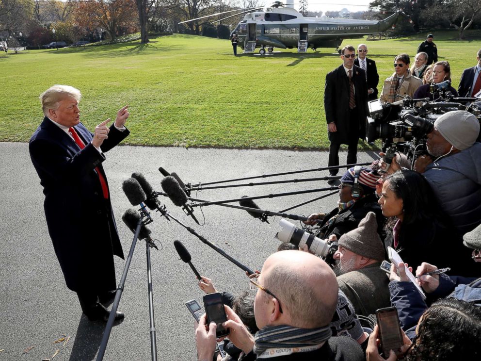 PHOTO: President Donald Trump answers questions from the press while departing the White House, Nov. 29, 2018 in Washington.