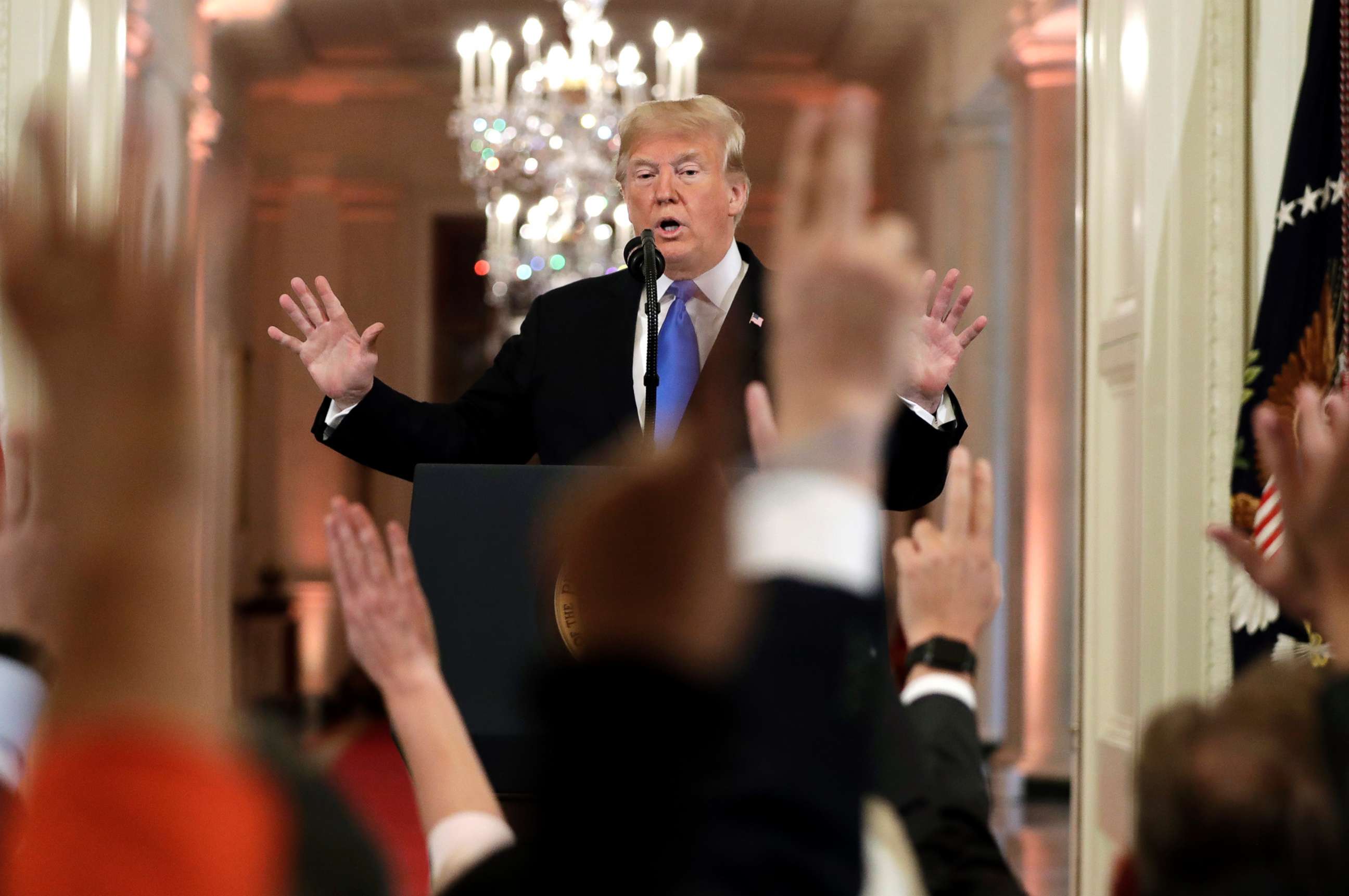 PHOTO: President Donald Trump reacts as reporters raise their hands to ask questions during a news conference in the East Room of the White House, Nov. 7, 2018, in Washington.