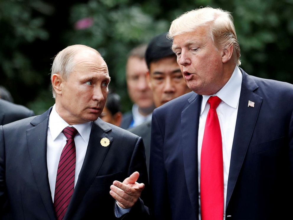 PHOTO: U.S. President Donald Trump and Russias President Vladimir Putin talk during the family photo session at the APEC Summit in Danang, Vietnam, November 11, 2017.