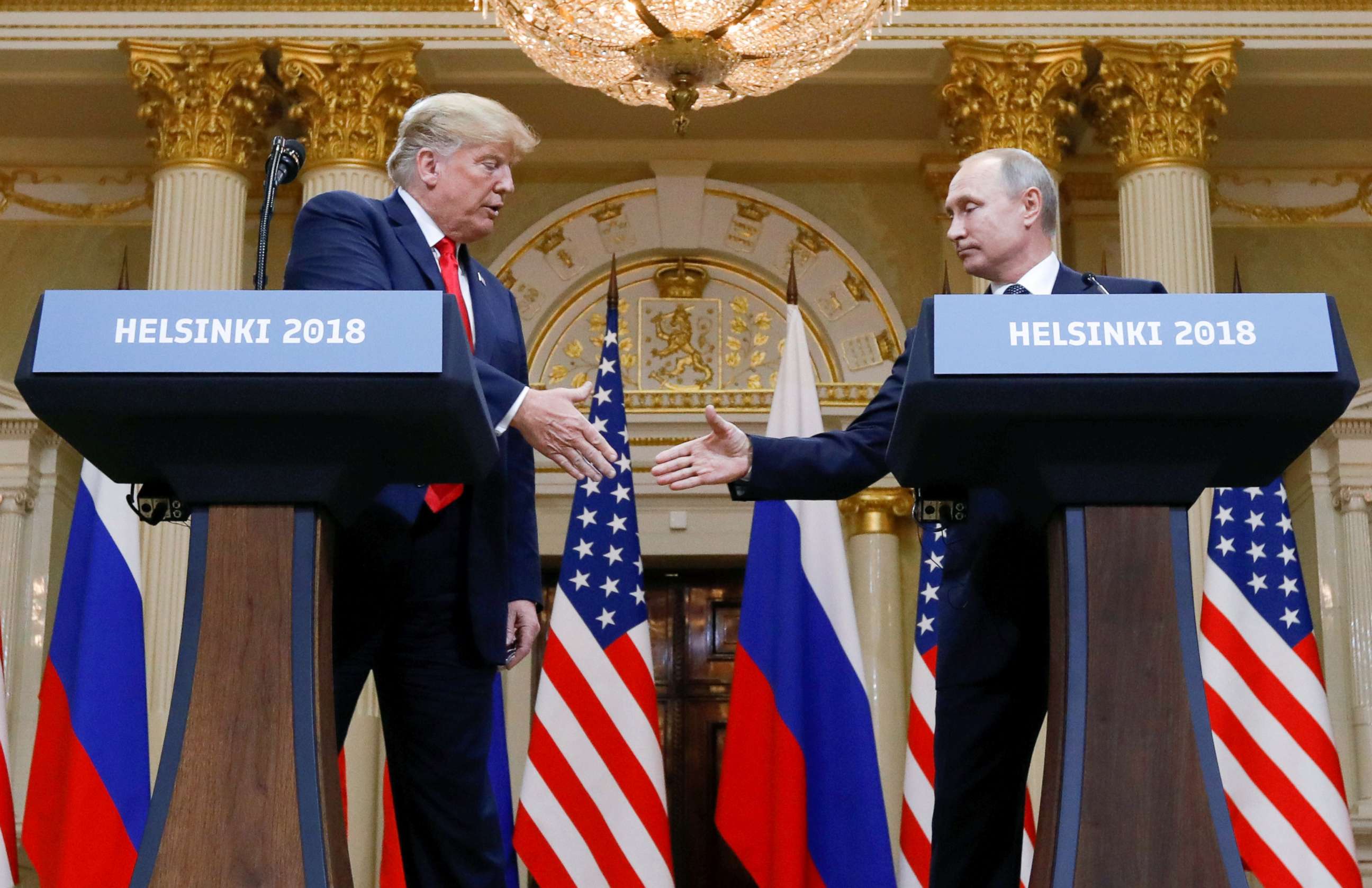 PHOTO: President Donald Trump and Russia's President Vladimir Putin shake hands during a joint news conference after their meeting in Helsinki, Finland, July 16, 2018.