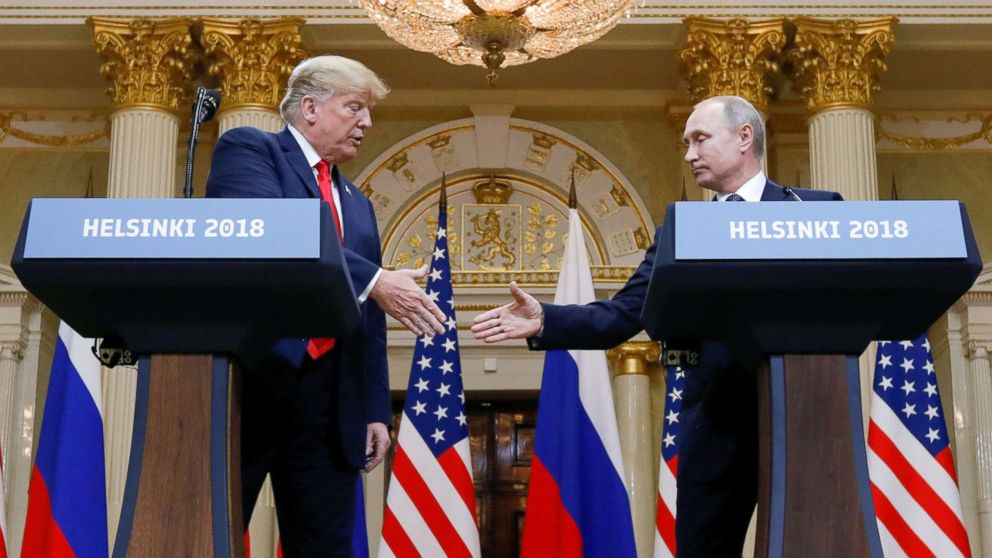 PHOTO: President Donald Trump and Russia's President Vladimir Putin shake hands during a joint news conference after their meeting in Helsinki, Finland, July 16, 2018.