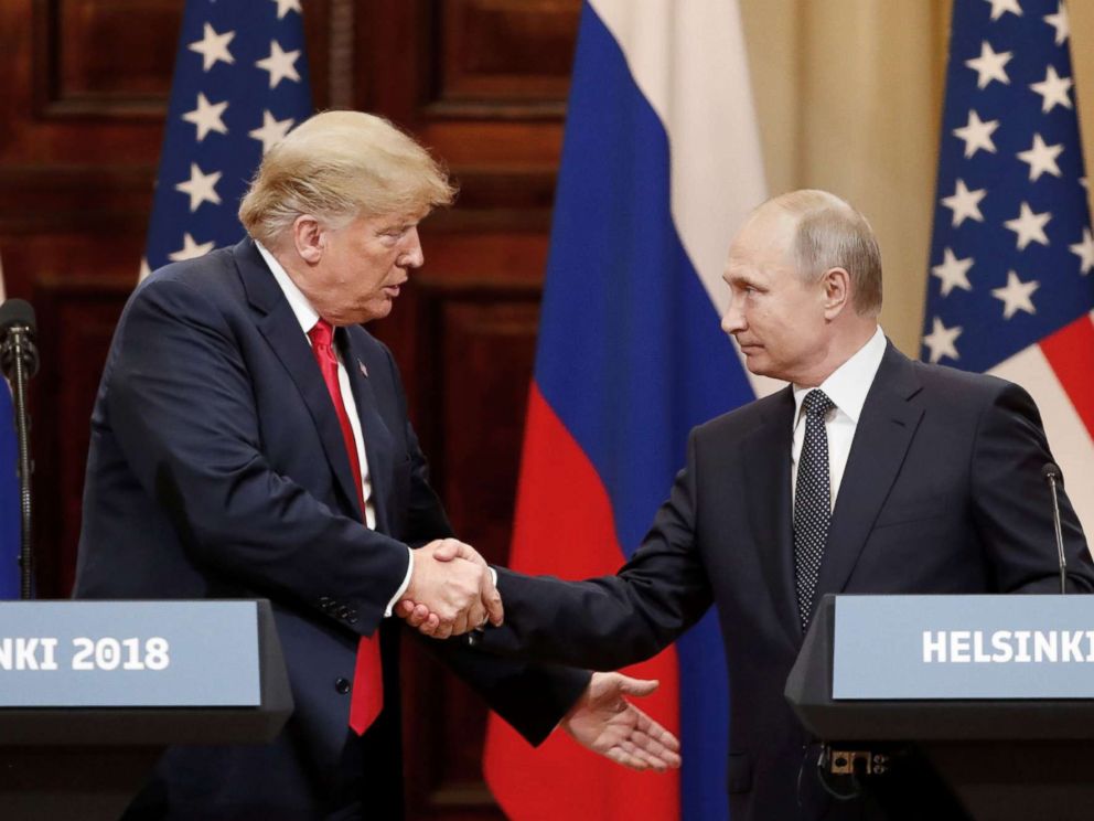   PHOTO: President Donald Trump and Russian President Vladimir Putin shake hands to hold a press conference after their meeting in Helsinki, Finland, July 16, 2018. 