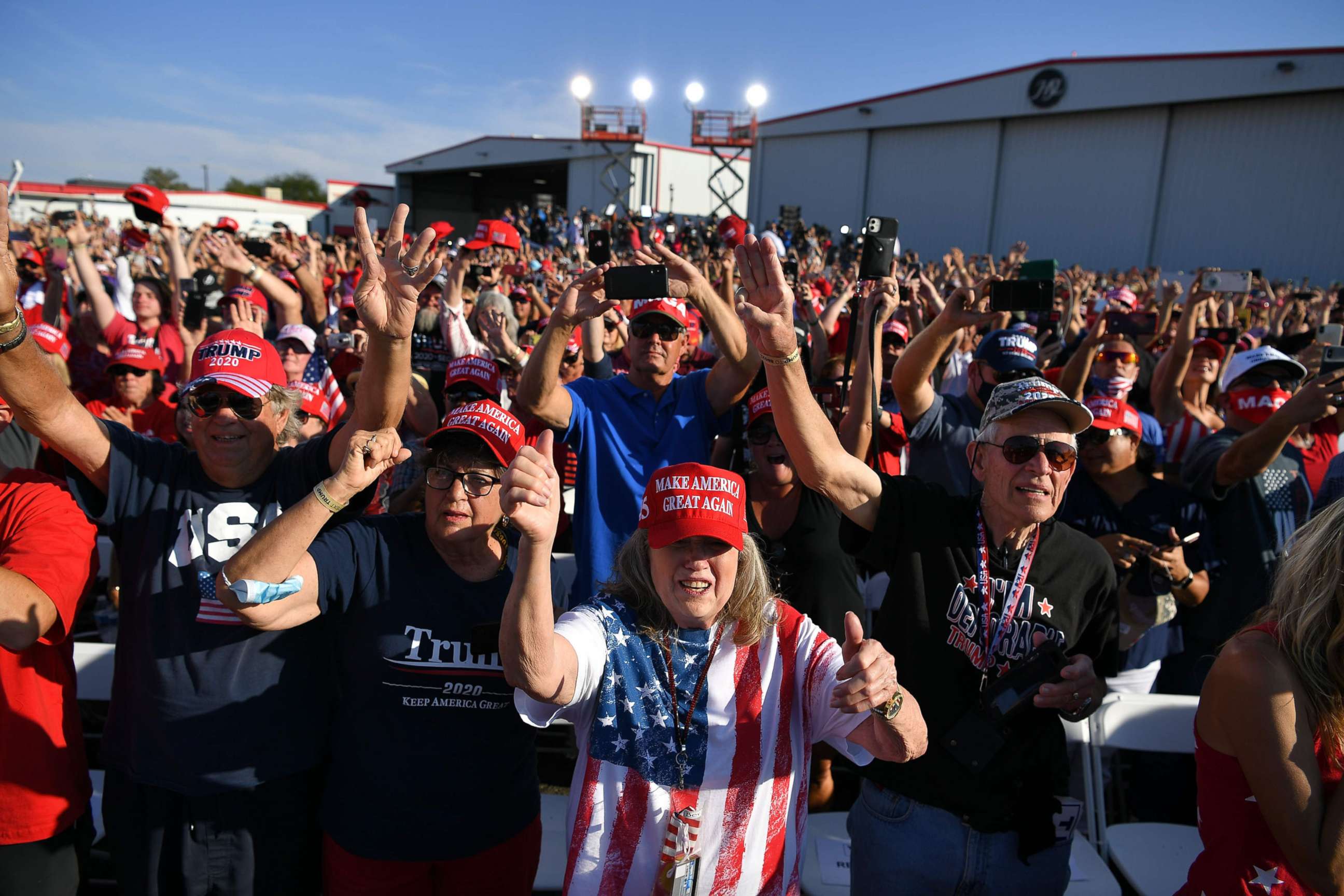 PHOTO: Supporters of President Donald Trump cheer during a rally at Prescott Regional Airport in Prescott, Arizona on Oct. 19, 2020.