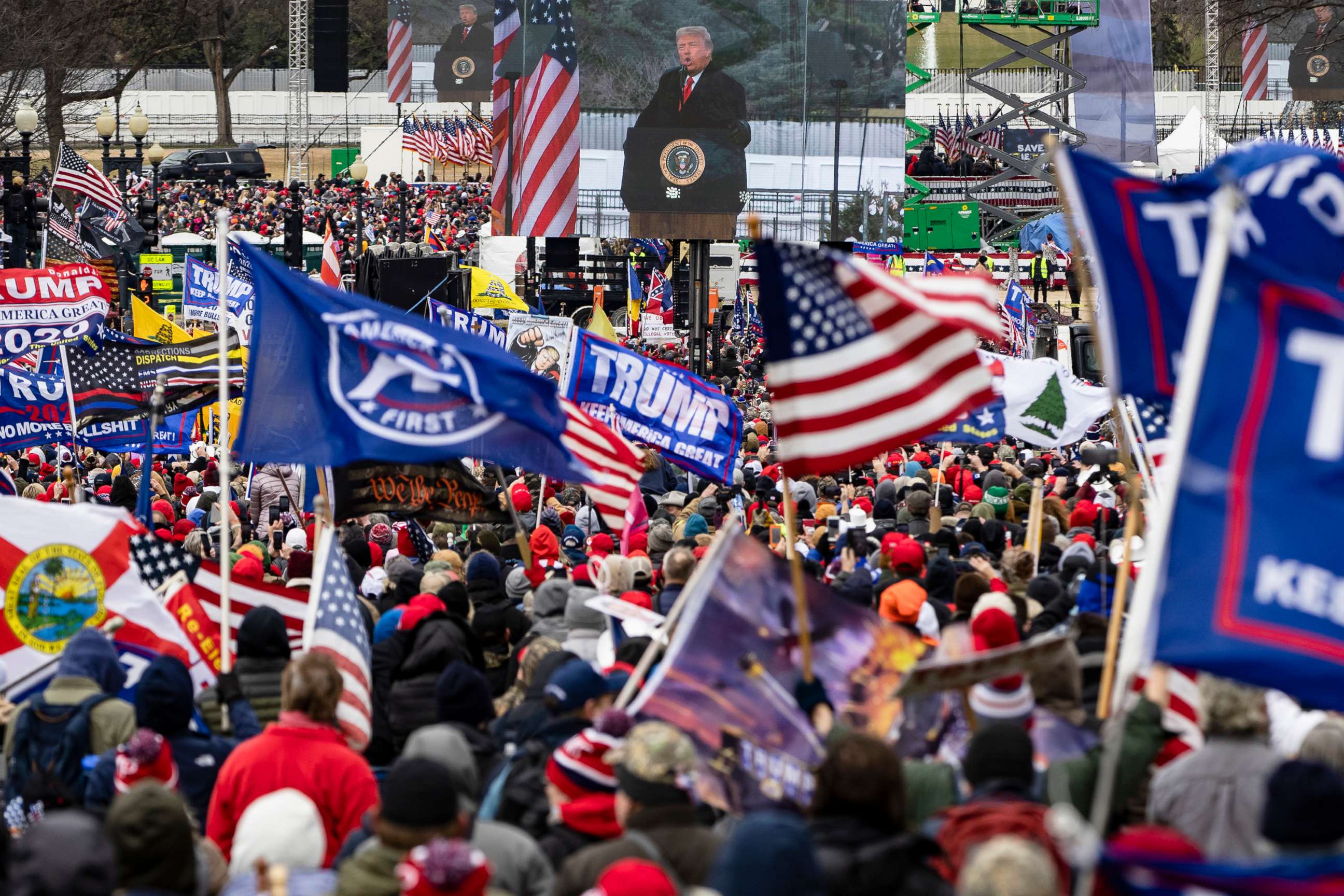 PHOTO: President Donald Trump is seen on a screen as his supporters cheer during a rally Jan. 6, 2021, in Washington, D.C.