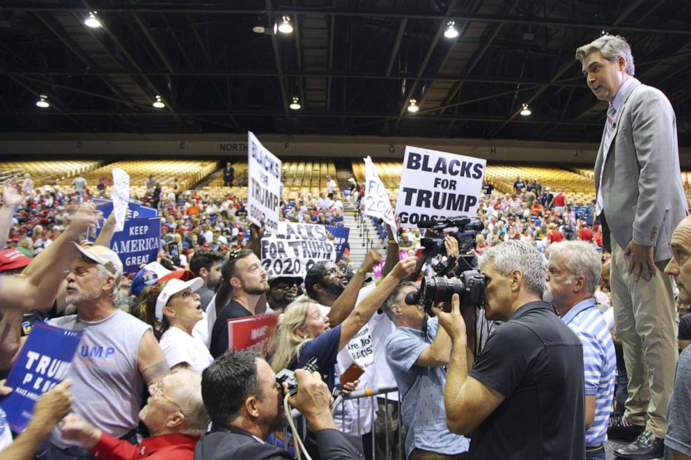 PHOTO: Supporters of President Donald Trump lash out at CNN reporter Jim Acosta during a rally in Tampa, Fla., July 31, 2018.