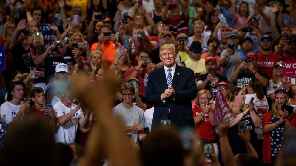 PHOTO: President Donald Trump listens as a crowd cheers his arrival at a campaign rally at the Big Sandy Superstore Arena on Aug. 3, 2017 in Huntington, W. Va.
