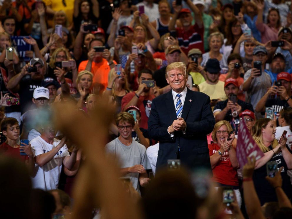 PHOTO: President Donald Trump listens as a crowd cheers his arrival at a campaign rally at the Big Sandy Superstore Arena on Aug. 3, 2017 in Huntington, W. Va.
