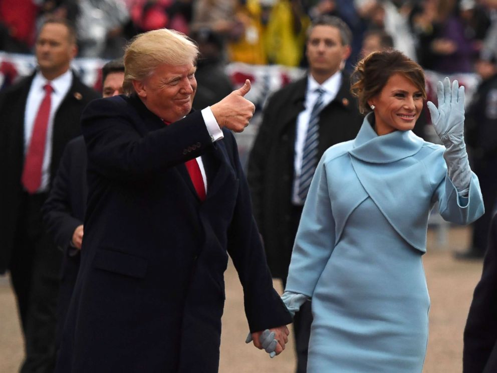 PHOTO: President Donald Trump and First Lady Melania walk the inaugural parade route on Pennsylvania Avenue in Washington, DC,Jan. 20, 2017 following the swearing-in ceremonies on Capitol Hill.