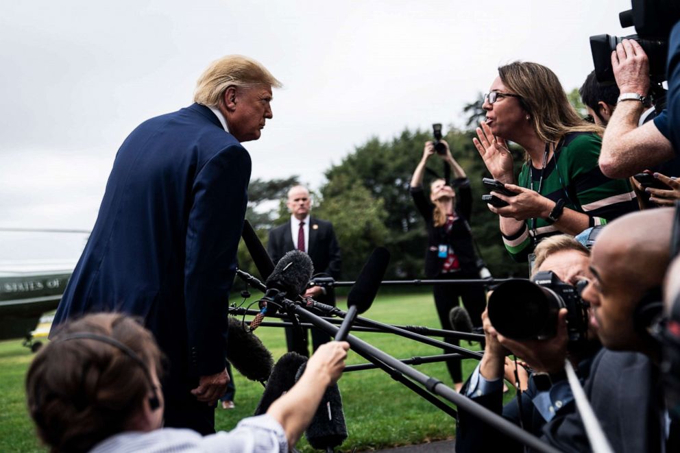 PHOTO: President Donald Trump speaks to reporters and members of the media as he walks to board Marine One on the South Lawn at the White House in Washington, Oct. 3, 2019.