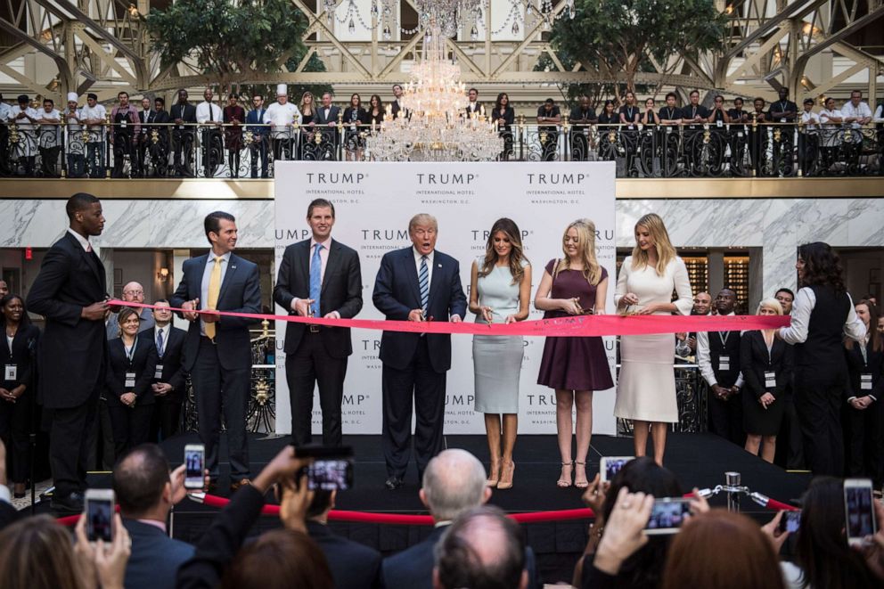 PHOTO: Donald Trump, accompanied by, from left, Donald Trump Jr., Eric Trump, Trump, Tiffany Trump, Melania Trump, and Ivanka Trump, cut a ribbon during the grand opening ceremony of the Trump International Hotel in Washington, D.C., Oct. 26, 2016.