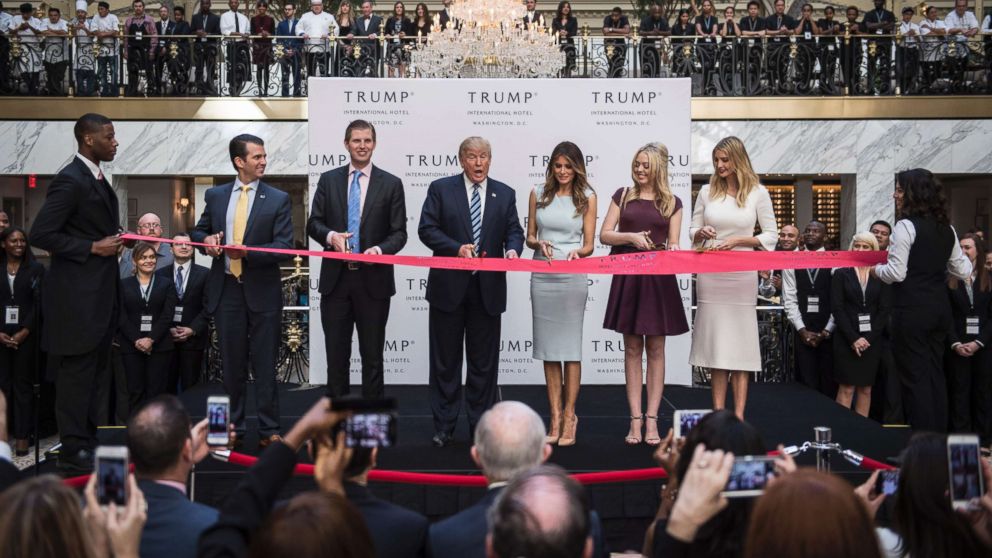 PHOTO: Donald Trump, accompanied by, from left, Donald Trump Jr., Eric Trump, Trump, Tiffany Trump, Melania Trump, and Ivanka Trump, cut a ribbon during the grand opening ceremony of the Trump International Hotel in Washington, D.C., Oct. 26, 2016.