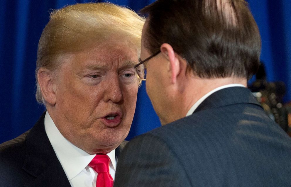 PHOTO: President Donald Trump speaks with Rod Rosenstein during a roundtable discussion on immigration at Morrelly Homeland Security Center in Bethpage, New York, May 23, 2018.