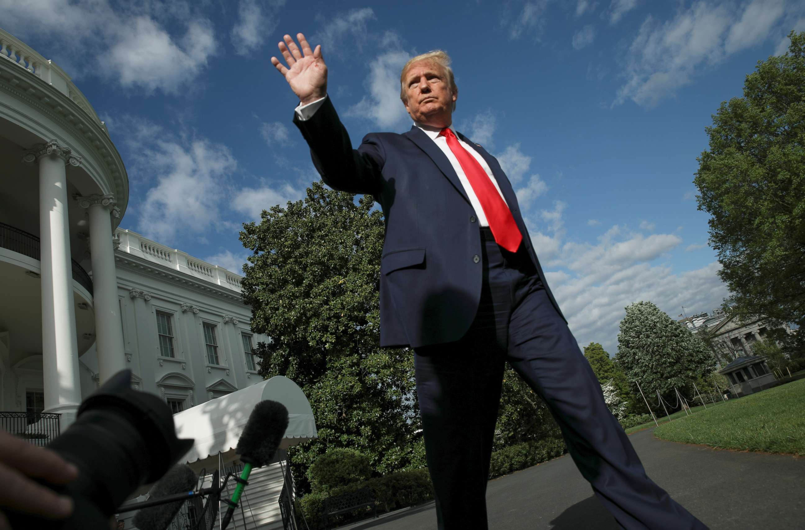 PHOTO: President Donald Trump waves as he departs on travel to the Camp David presidential retreat from the South Lawn at the White House in Washington, May 1, 2020. 