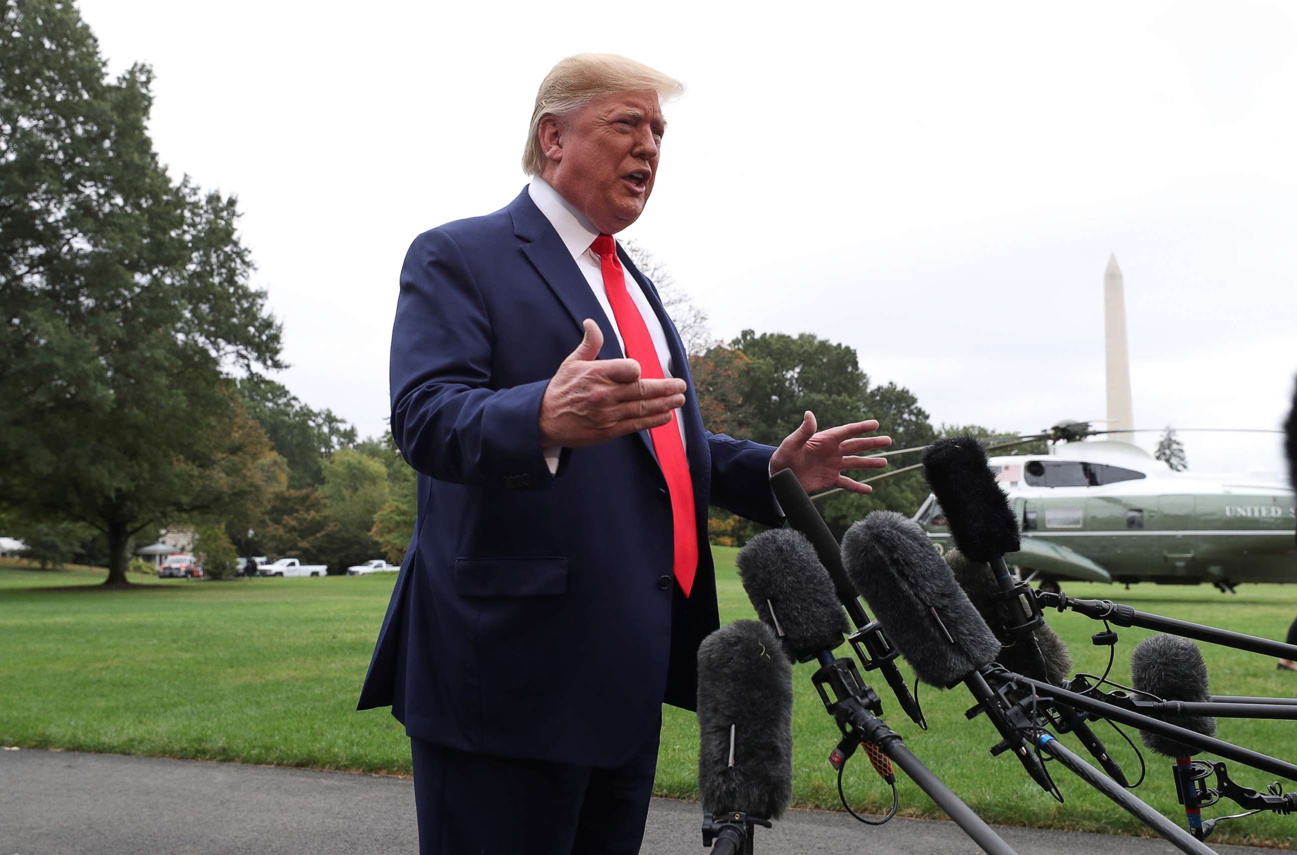 PHOTO: President Donald Trump talks to reporters as he departs for travel to Florida from the South Lawn of the White House in Washington, Oct. 3, 2019.