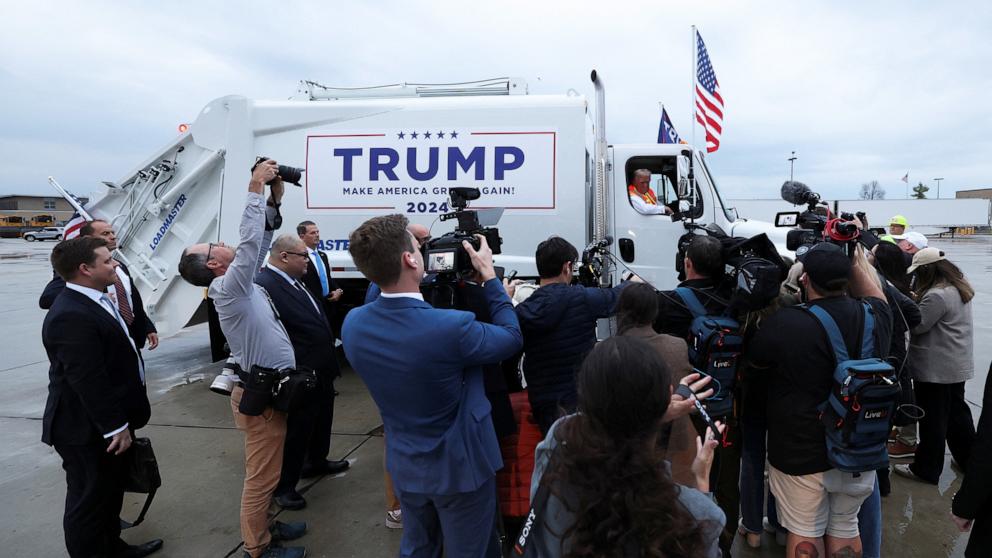 PHOTO: Republican presidential nominee and former President Donald Trump speaks to the members of the media, as he sits in a garbage truck, in Green Bay, Wisconsin, Oct. 30, 2024.