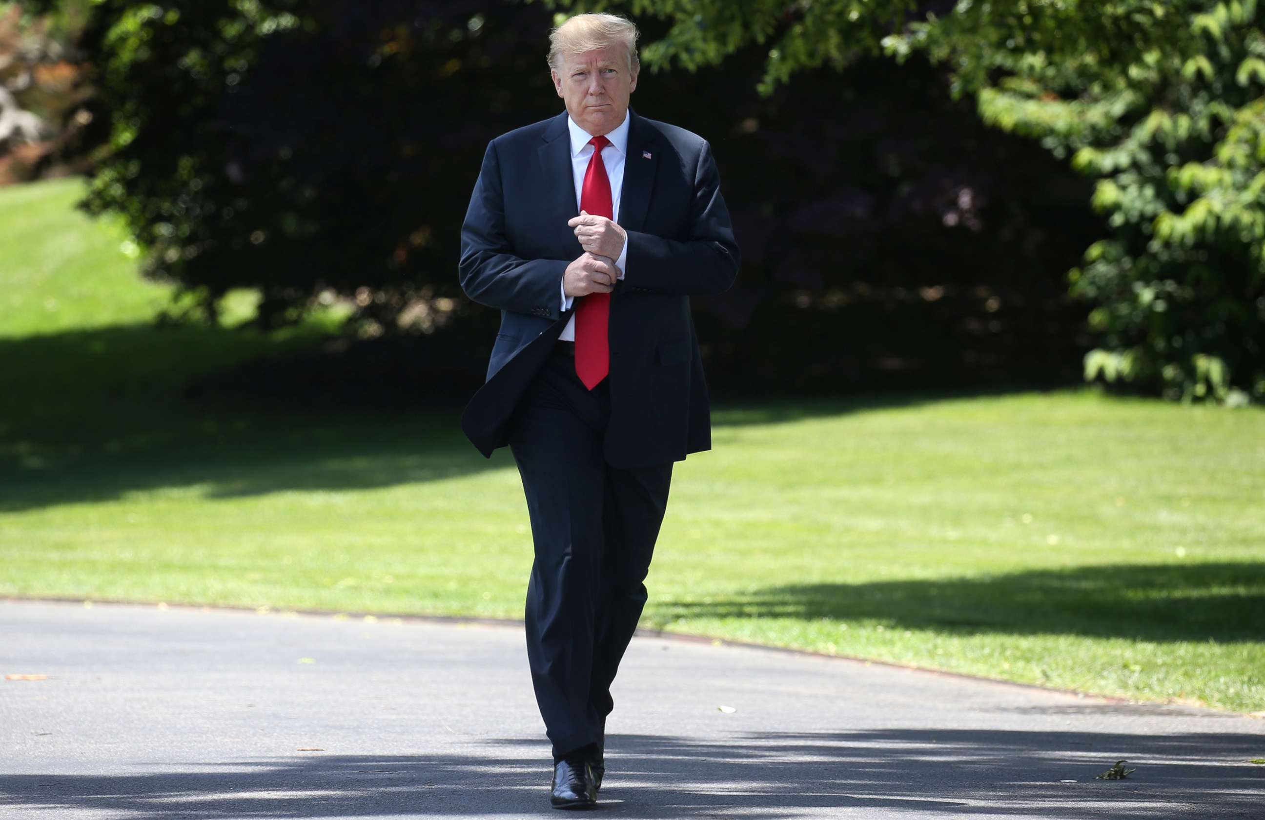 PHOTO: President Donald Trump leaves the Oval Office to speak to the news media before boarding Marine One from the South Lawn of the White House, May 24, 2019.