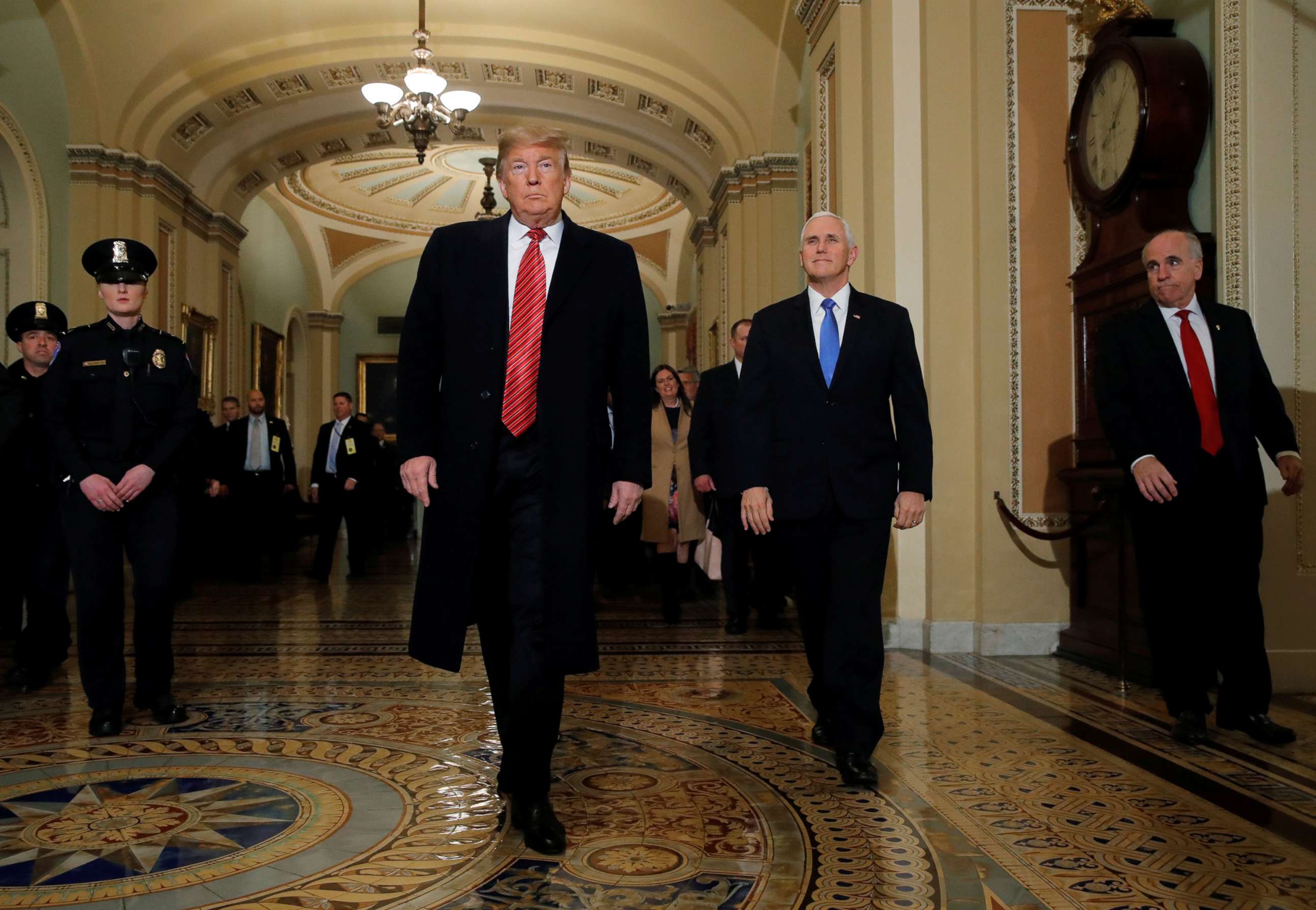 PHOTO: President Donald Trump is accompanied by Vice President Mike Pence as they arrives to attend a closed Senate Republican policy lunch as a partial government shutdown entered its 19th day on Capitol Hill in Washington, Jan. 9, 2019.