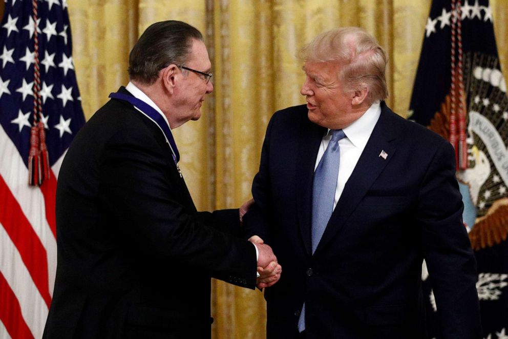 PHOTO: President Donald Trump shakes hands after presenting the Presidential Medal of Freedom to former Vice Chief of Staff of the Army Gen. Jack Keane in the East Room of the White House in Washington, March 10, 2020.