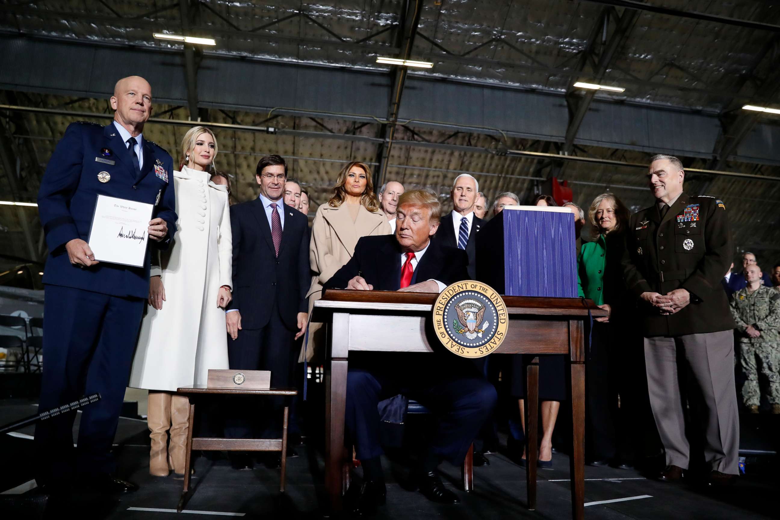 PHOTO: President Donald Trump signs the National Defense Authorization Act for Fiscal Year 2020 at Andrews Air Force Base, Md., Dec. 20, 2019.
