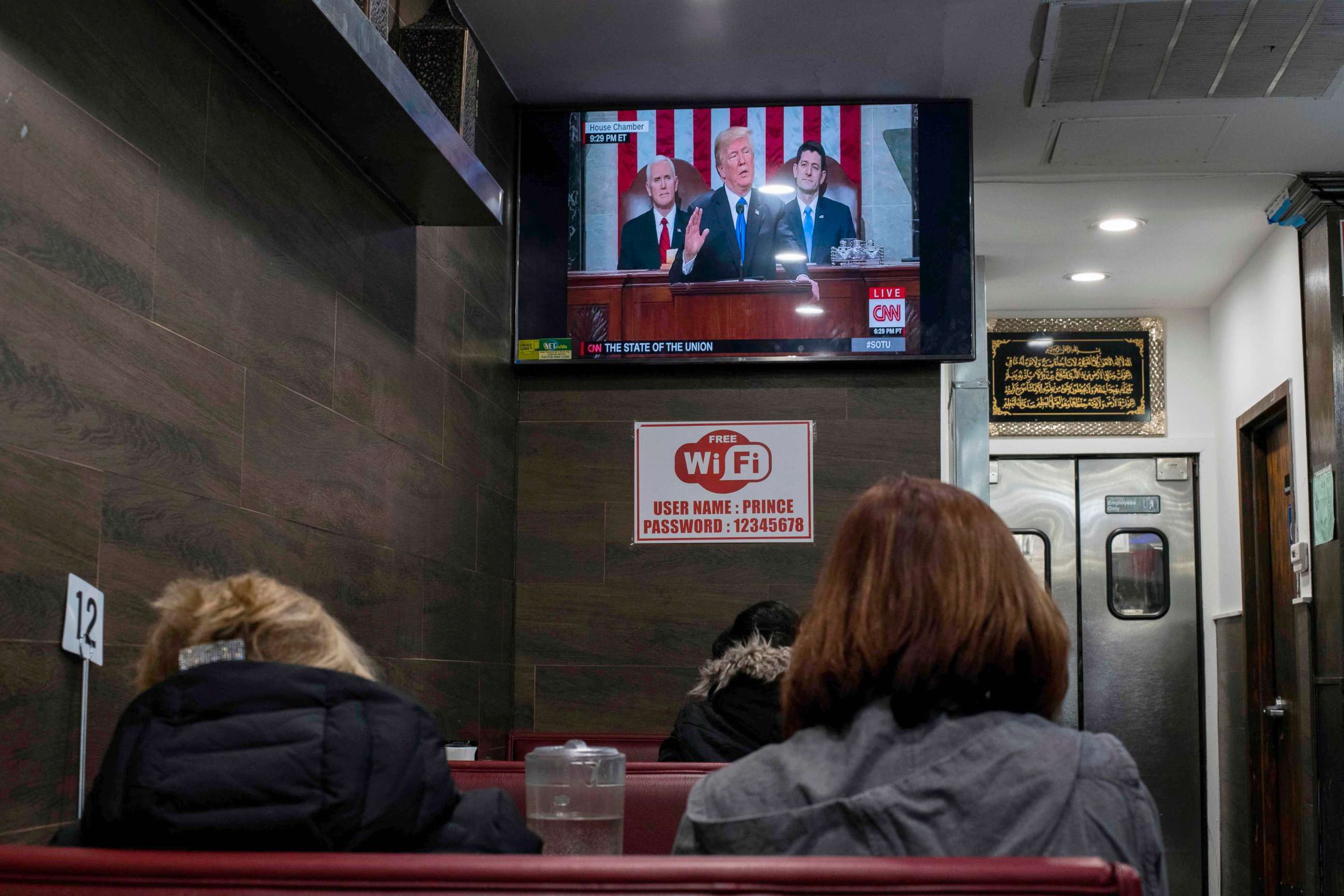 PHOTO: President Donald Trump is shown on a TV, delivering his State of the Union Speech, in a restaurant in New York on Jan. 30, 2018.