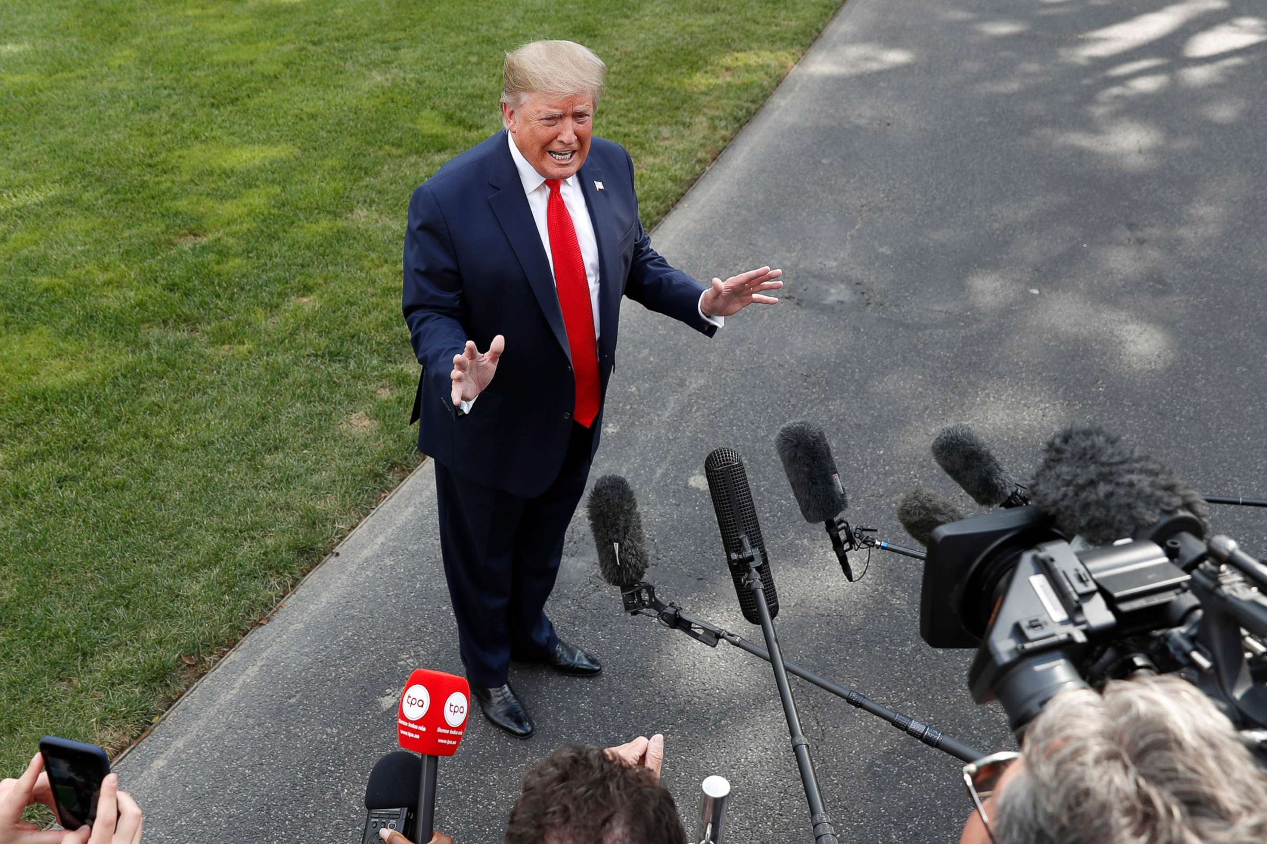 PHOTO: President Donald Trump speaks to the media about the testimony of White House Special Counsel Robert Mueller to Congress, July 24, 2019, outside the White House.