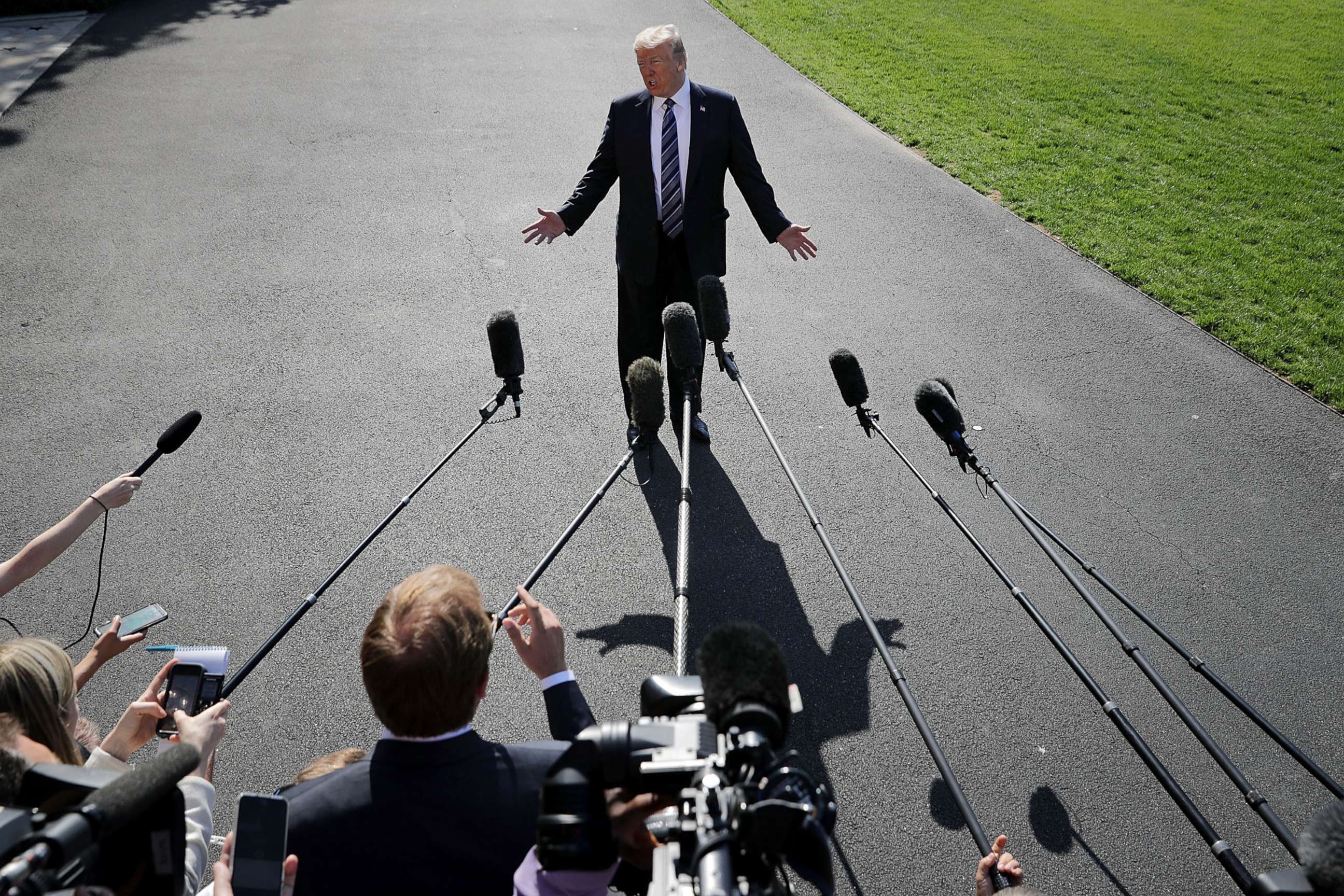 PHOTO: President Donald Trump talks to members of the news media before departing the White House, May 25, 2018 in Washington, D.C.