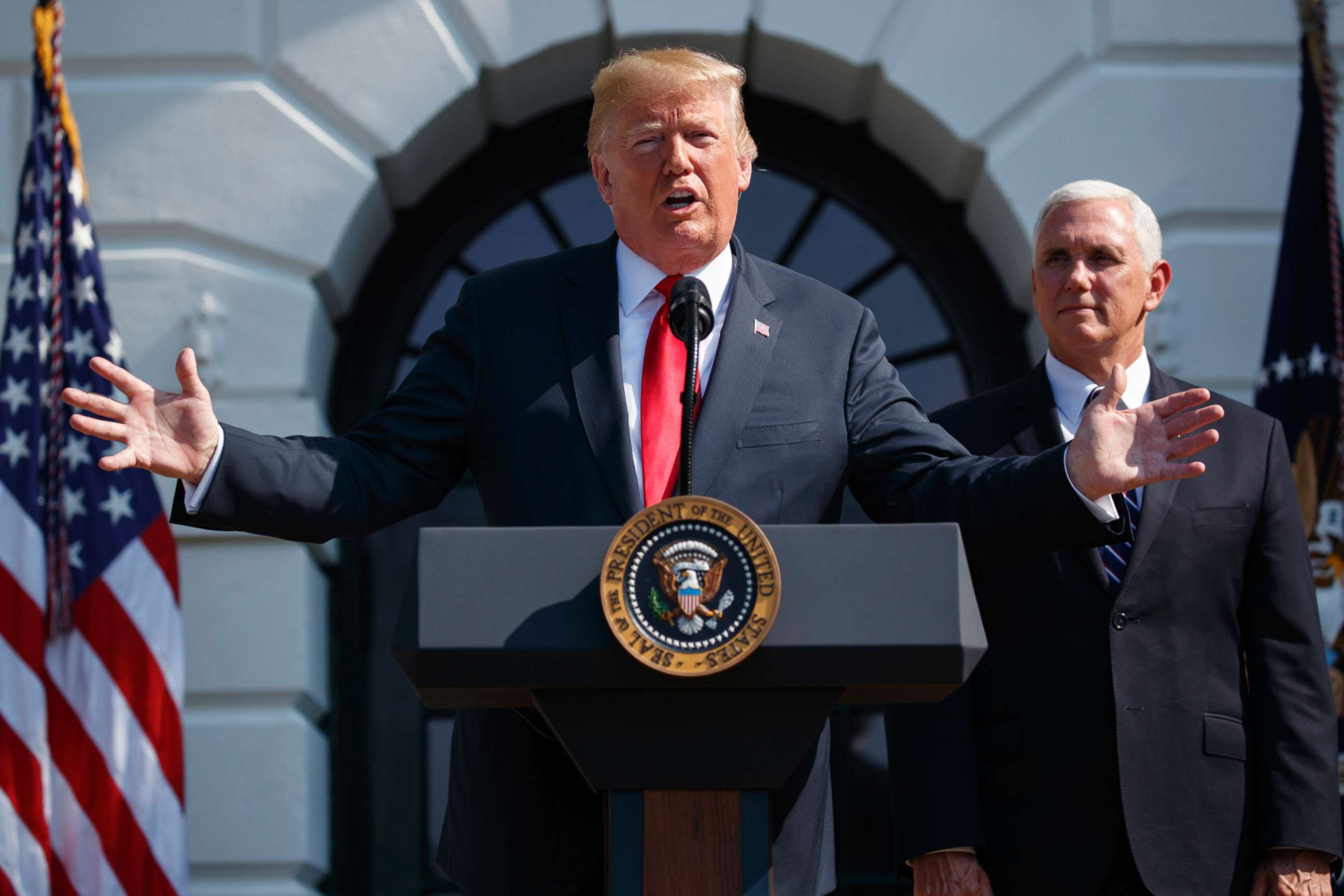 PHOTO: President Donald Trump delivers remarks about the economy on the South Lawn of the White House with Vice President Mike Pence, July 27, 2018.