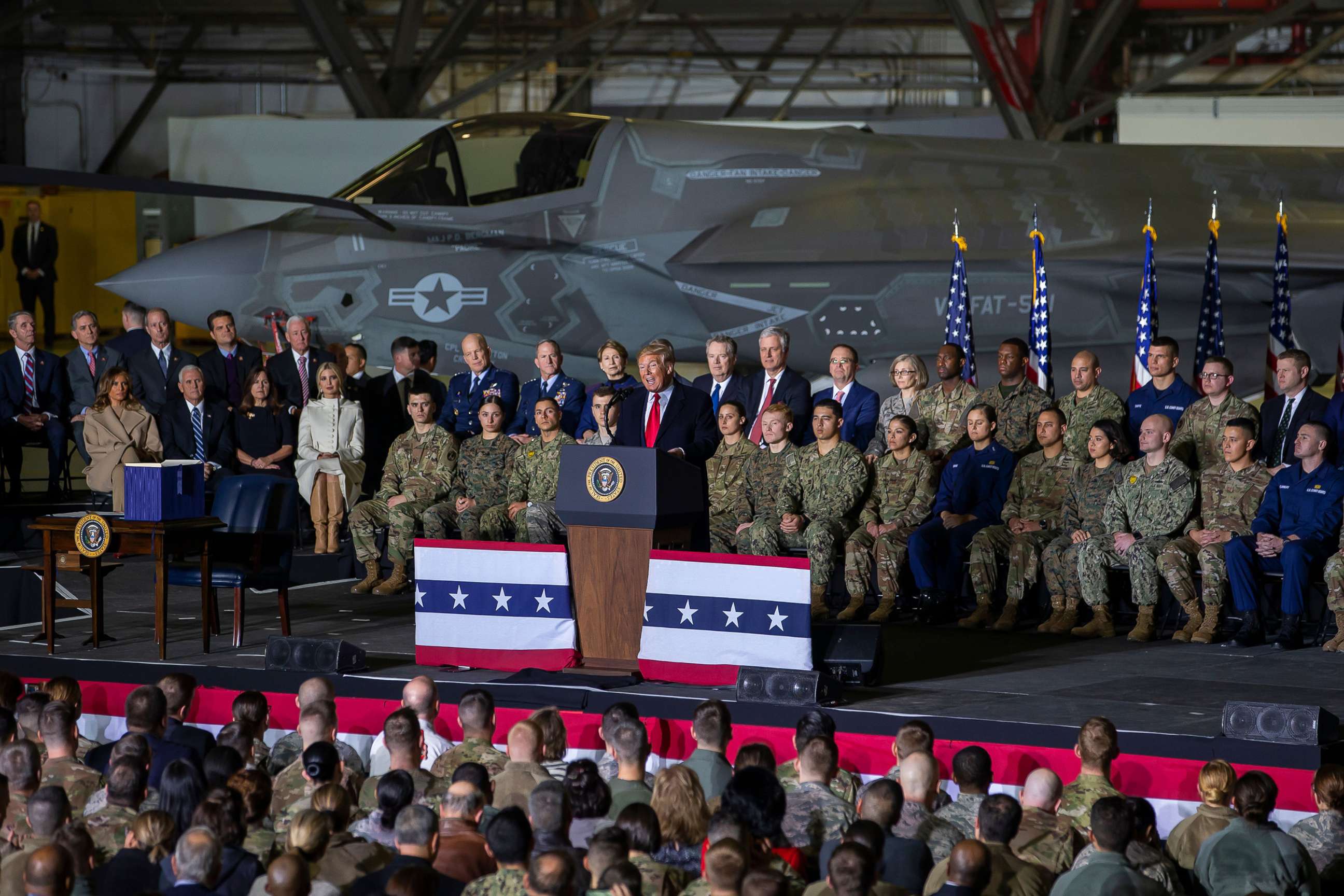 PHOTO: President Donald J. Trump speaks on stage during the signing ceremony for the National Defense Authorization Act for Fiscal Year 2020 inside Hangar Six at Joint Base Andrews in Suitland, M.D., Dec. 20, 2019.