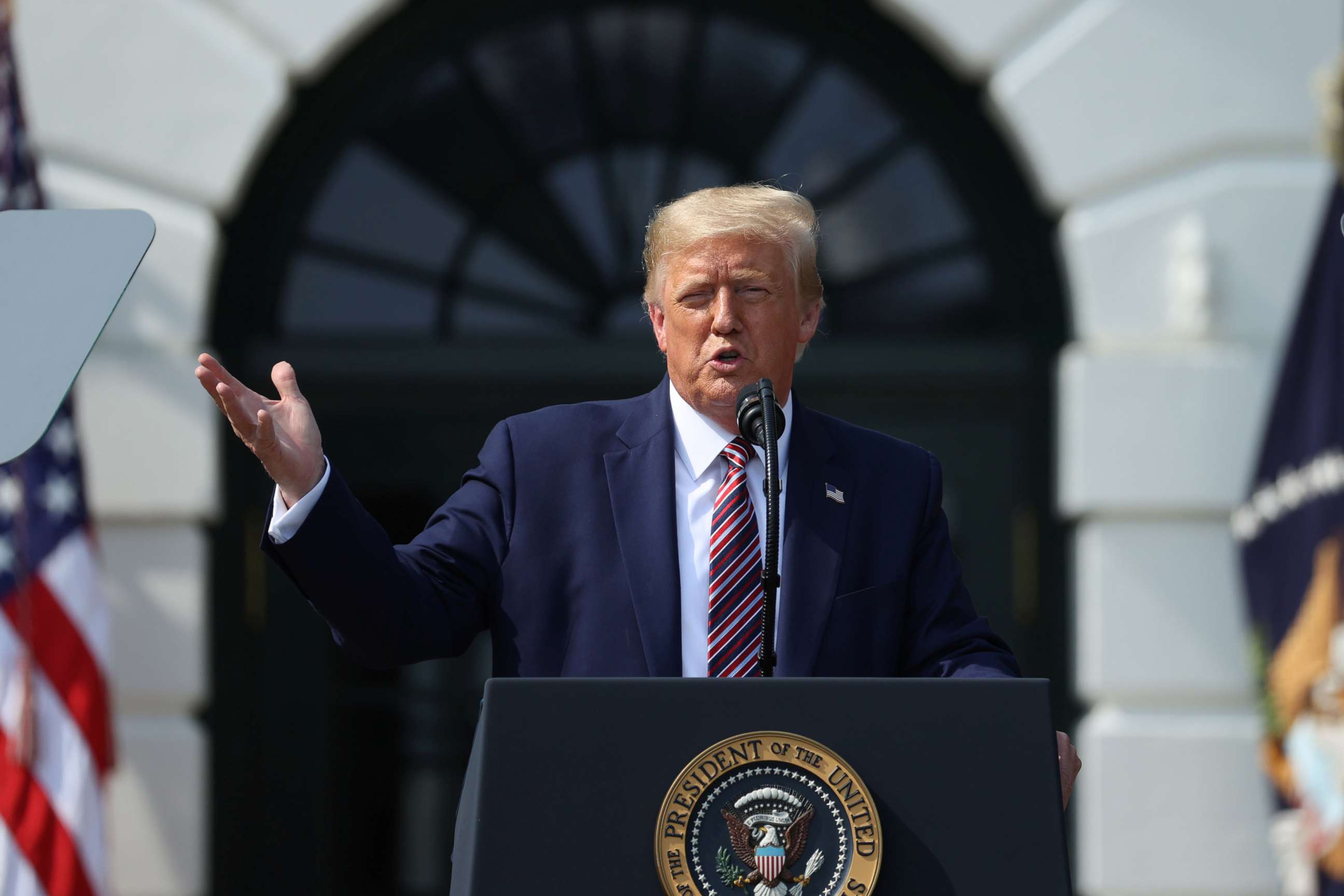 PHOTO: President Donald Trump touts administration efforts to curb federal regulations during an event on the South Lawn of the White House in Washington, July 16, 2020. 