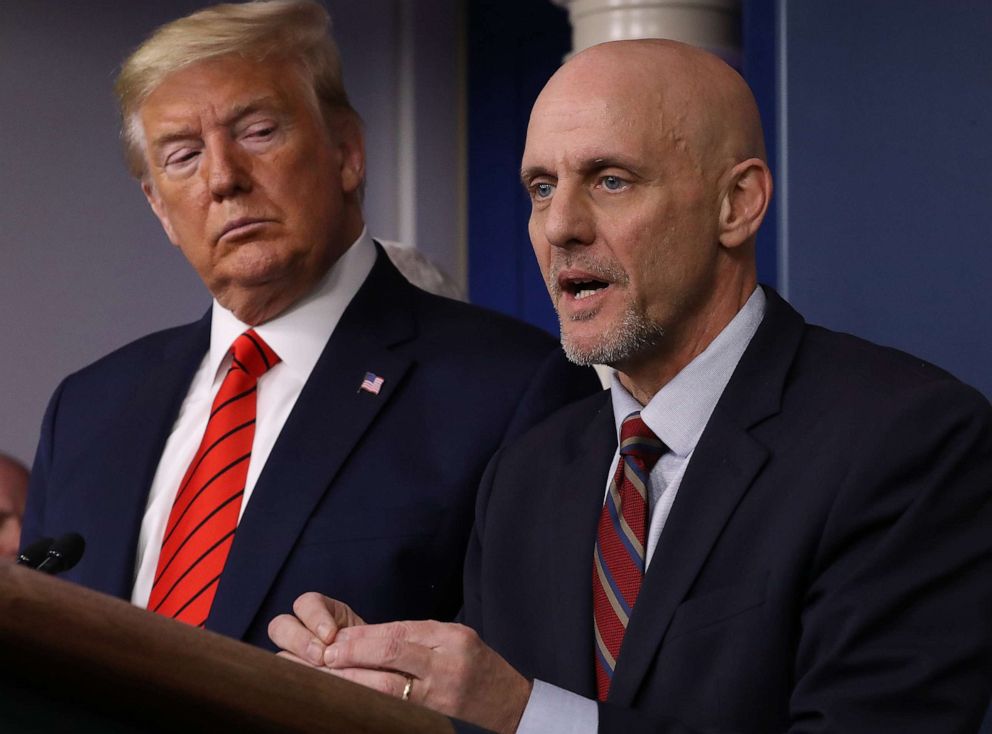 PHOTO: President Donald Trump listens to FDA Commissioner Stephen Hahn speak on the latest developments of the coronavirus outbreak, in the James Brady Press Briefing Room at the White House March 19, 2020, in Washington, DC.